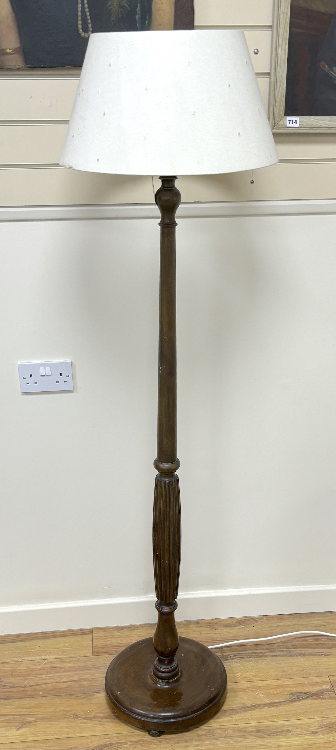 A mahogany standard lamp with shade, height including shade 170cm